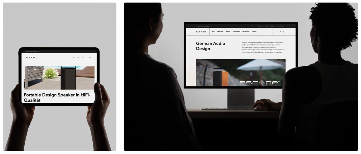Zwei Personen betrachten die Website von sonoro audio GmbH auf einem Tablet und einem Desktop-Bildschirm. Die Website zeigt hochwertige HiFi-Lautsprecher und German Audio Design.